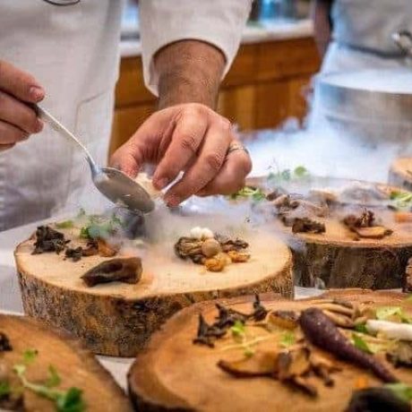 chef-preparing-vegetable-dish-on-tree-slab-1267320